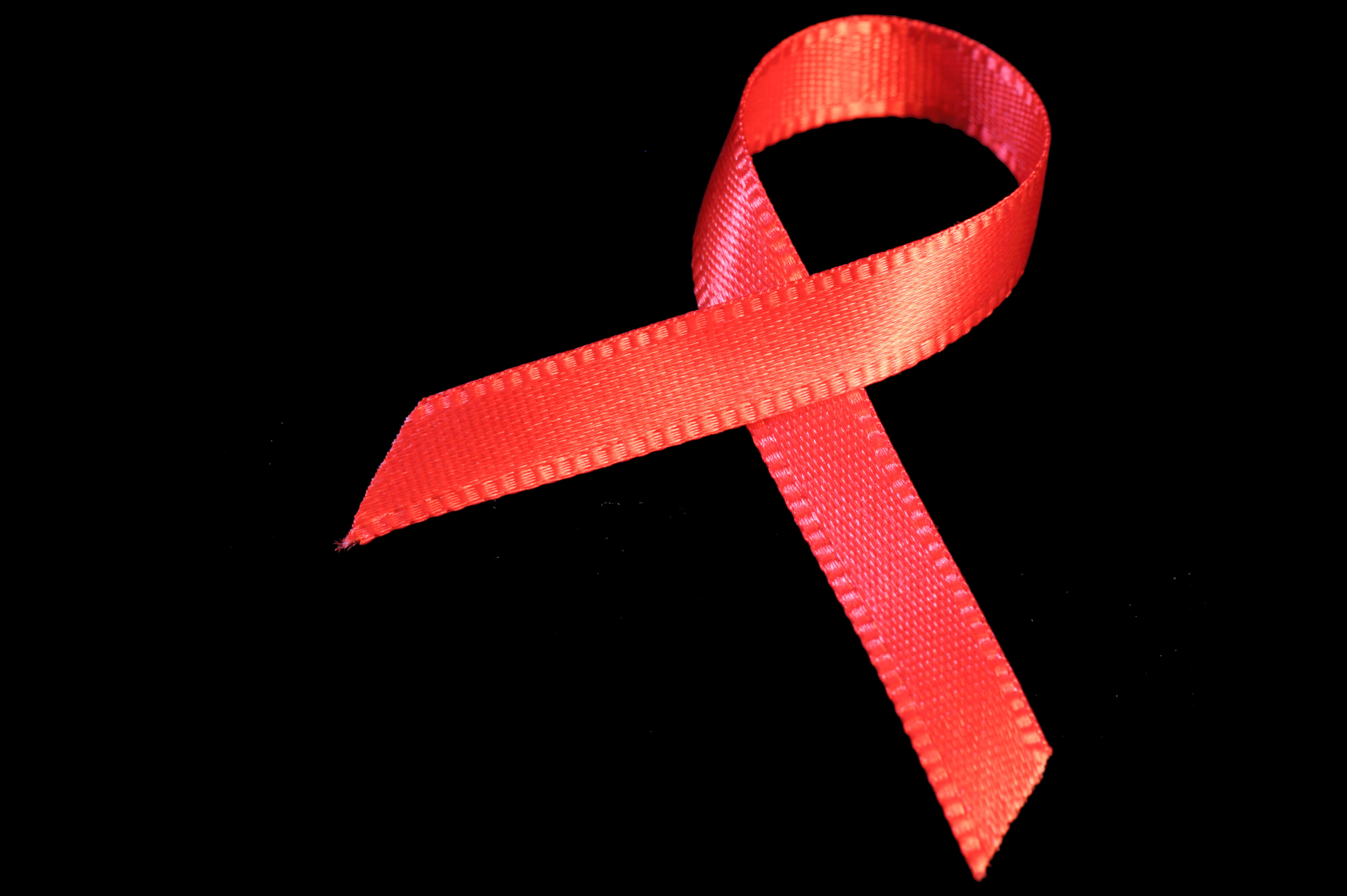 Real red ribbon aids ppt backgrounds pictures, charity crest