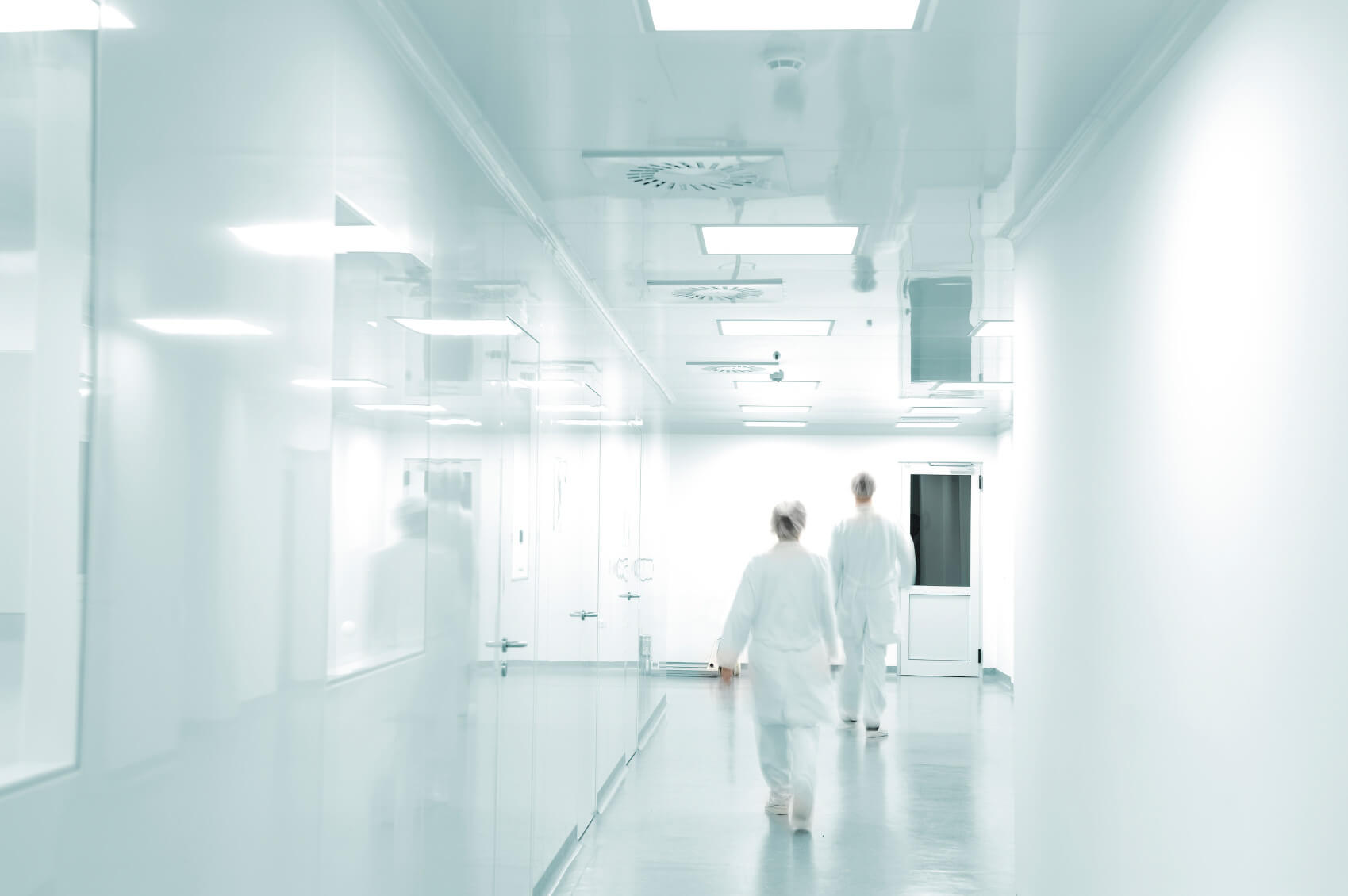 Doctors walking down corridors hospital powerpoint backgrounds free download